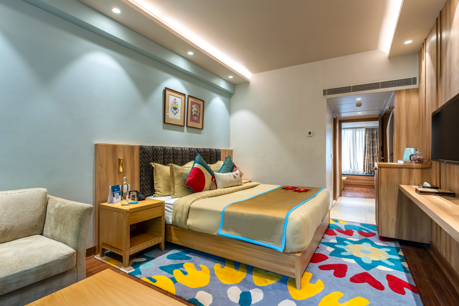 Cosy and comfortable Deluxe Room at Bookmark Resorts, Manali, with modern decor and amenities