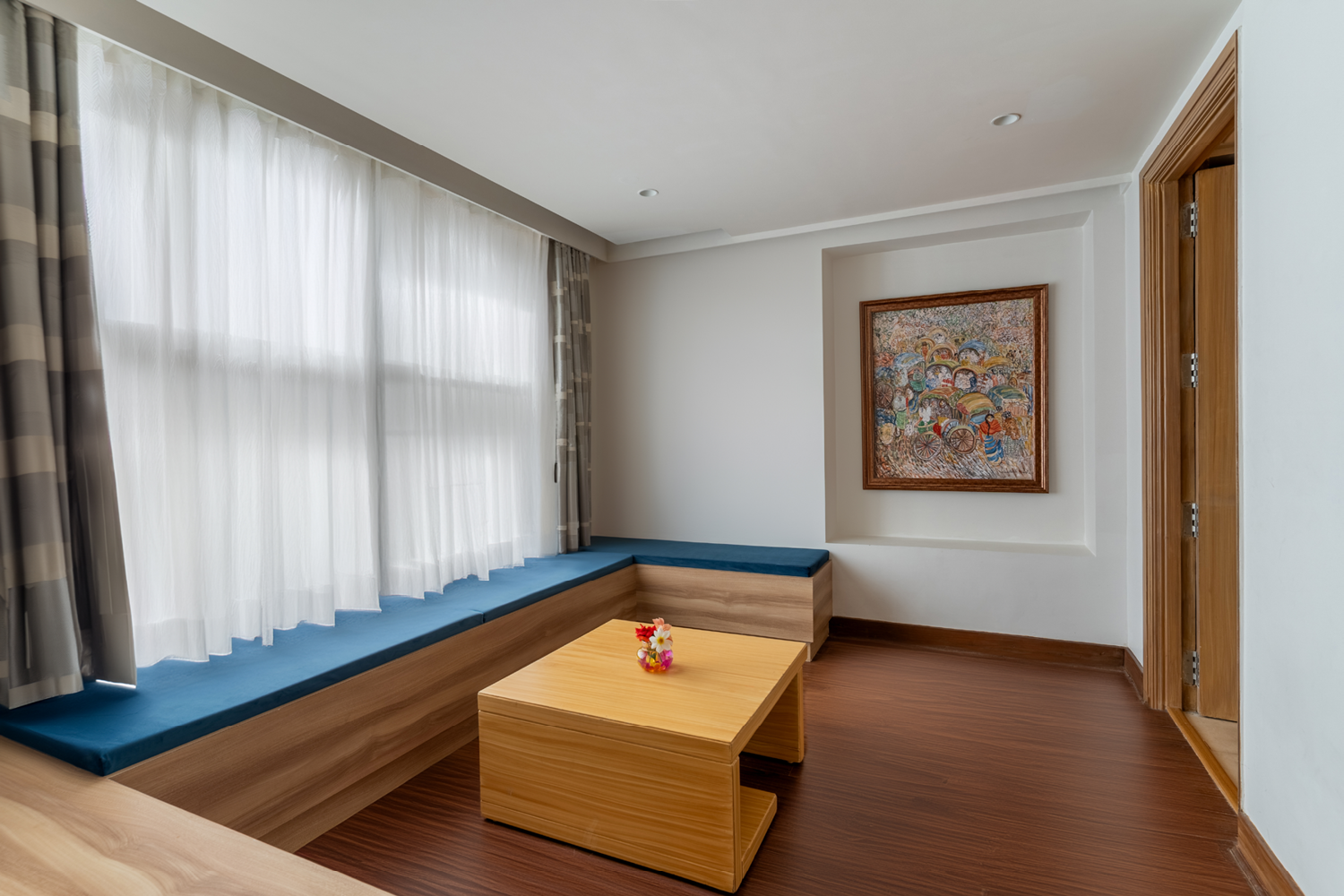 Cozy seating area in the Deluxe Room at Bookmark Resorts, Manali.