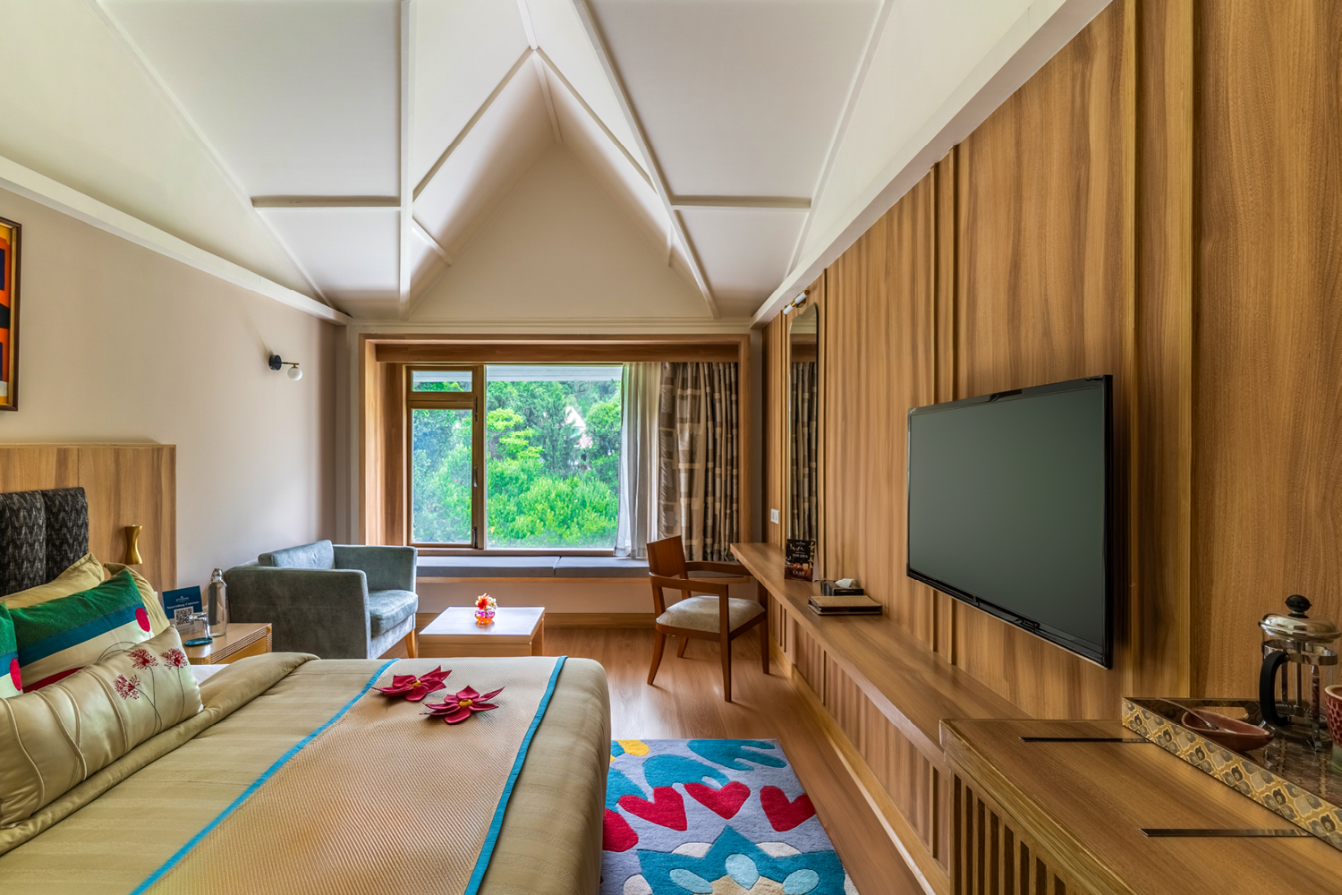 Spacious Superior Room at Bookmark Resorts, Manali, with scenic mountain and forest views and modern amenities