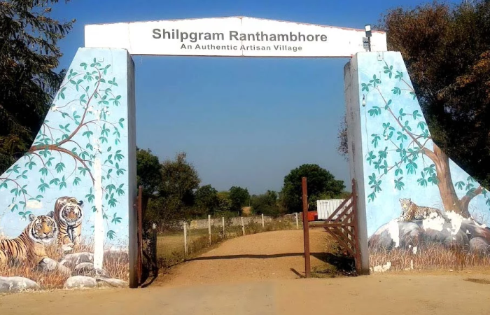 Entrance of Shilpgram Ranthambore featuring artwork of tigers and nature | Shilpgram Ranthambore